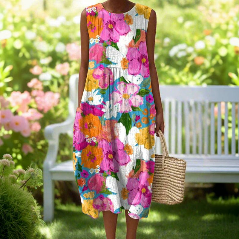 Färgglad Midi Klänning med Blommönster och Fickor – Ärmlös Design i Bomull och Polyester - STILUNA