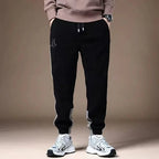 Mjuka Corduroy Sweatpants med Tri - Färgad Design och Tre Fickor - STILUNA