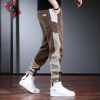 Mjuka Corduroy Sweatpants med Tri - Färgad Design och Tre Fickor - STILUNA