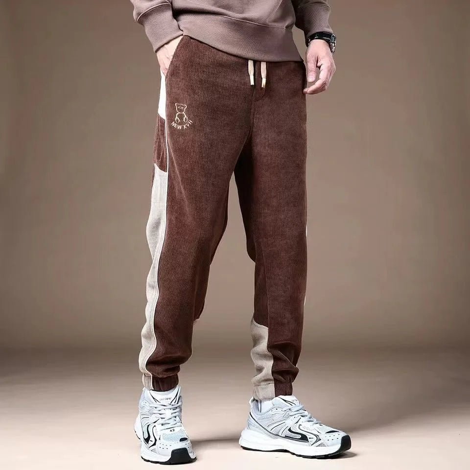 Mjuka Corduroy Sweatpants med Tri - Färgad Design och Tre Fickor - STILUNA